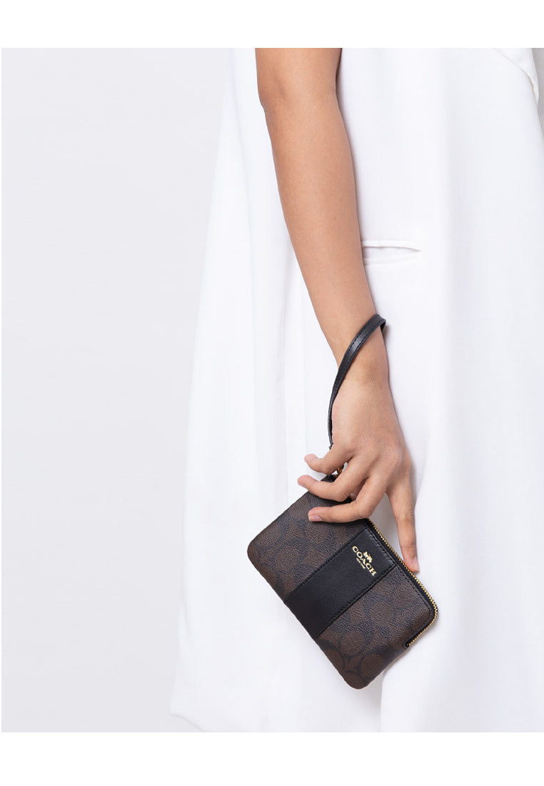 Coach Corner Zip Wristlet In Signature Coated Canvas - Dark Brown